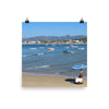 Beach with vibrant blues, boats, and mountains behind - Print